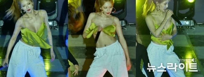 공연 중 브라탑 리본이 풀리자 손으로 자연스럽게 감싸며 노래를 이어나가는 현아
